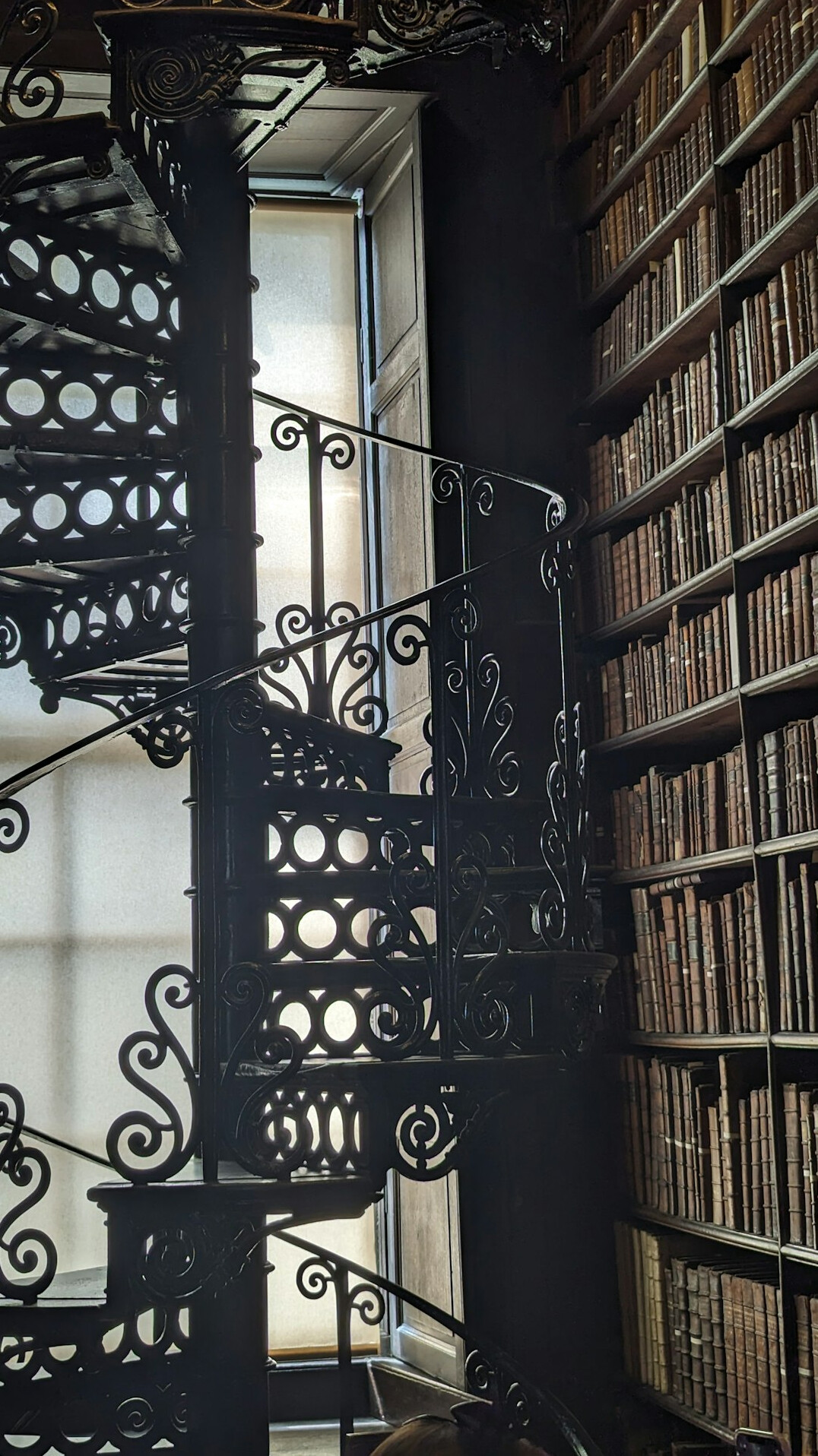 Reading room of a historic library with long tables