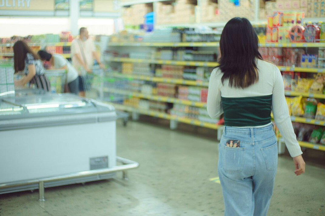 store security guard watching customer