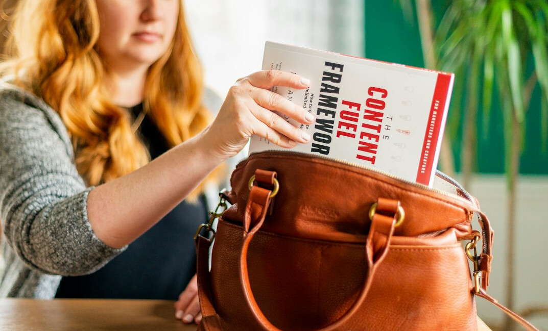 woman hiding product in purse